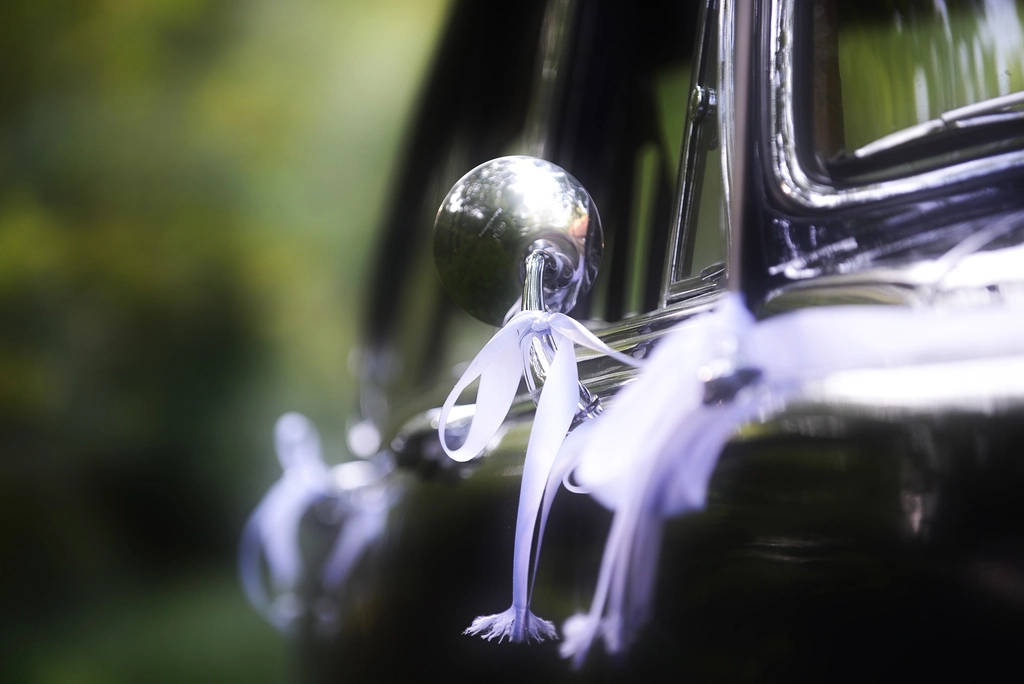 A ribboned wedding car
